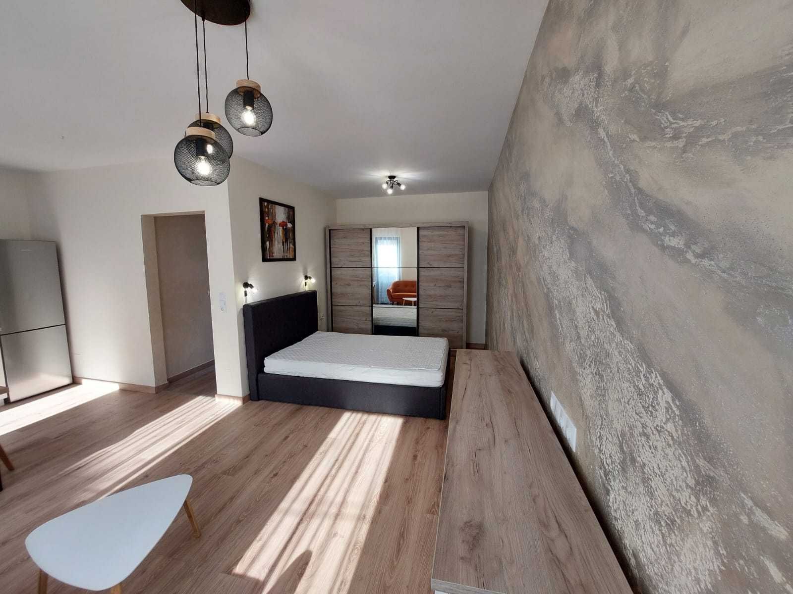 Bedroom area — Modern Studio Apartment in the City Center