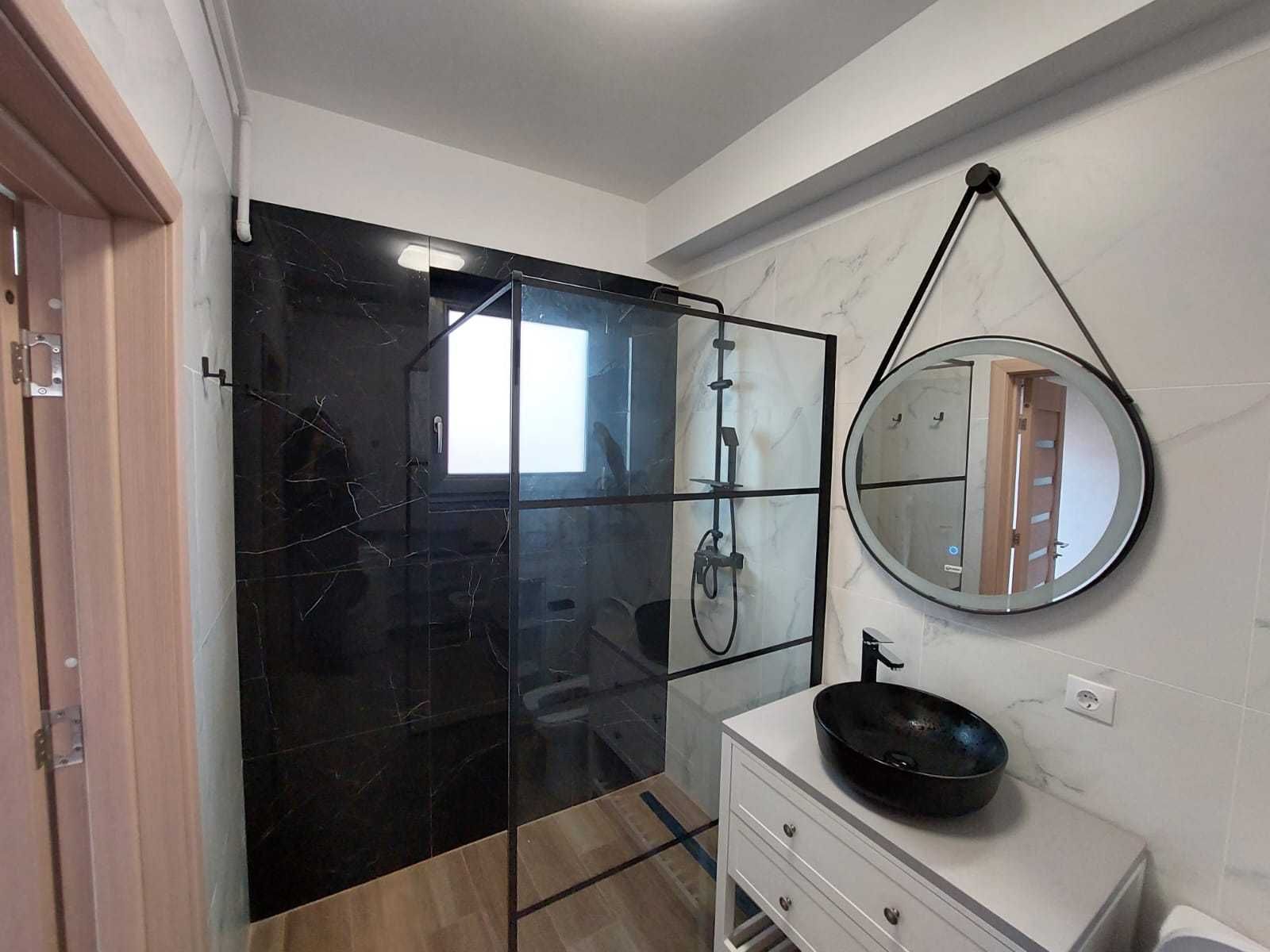 Bathroom shower — Modern Studio Apartment in the City Center