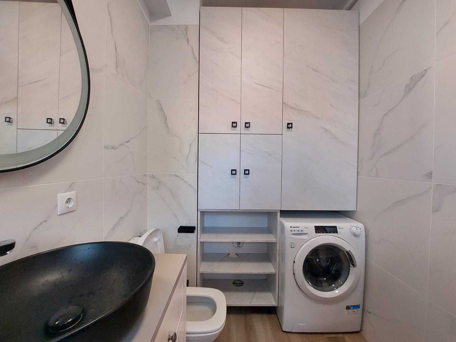 Bathroom and laundry — Modern Studio Apartment in the City Center